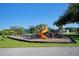 Modern playground with slides and play equipment at 9 Bunker Ln, Rotonda West, FL 33947