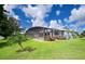 Relaxing pool area with screened enclosure and lush landscaping at 9 Bunker Ln, Rotonda West, FL 33947