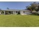 Large backyard with grassy area and screened porch at 21019 Lawson Ave, Port Charlotte, FL 33952