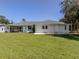 Spacious backyard with grassy area and patio at 21019 Lawson Ave, Port Charlotte, FL 33952