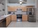 Modern kitchen with stainless steel appliances and ample wood cabinetry at 21019 Lawson Ave, Port Charlotte, FL 33952
