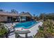 Backyard pool with patio, mature landscaping, and access to a screened-in lanai perfect for outdoor entertaining at 2521 Northway Dr, Venice, FL 34292