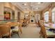 Community room with tables, chairs, and a fireplace at 4522 Cancello Grande Ave, Venice, FL 34293