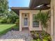Inviting front entrance with brick pavers and lush landscaping at 4522 Cancello Grande Ave, Venice, FL 34293