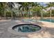 Relaxing hot tub next to the community pool at 4522 Cancello Grande Ave, Venice, FL 34293