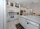 Well-equipped kitchen featuring white appliances and ample counter space at 4522 Cancello Grande Ave, Venice, FL 34293