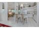 Clean and bright kitchen with white cabinets and a breakfast bar at 4522 Cancello Grande Ave, Venice, FL 34293