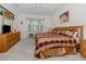 King-size bed, large windows, and wood furniture in main bedroom at 4522 Cancello Grande Ave, Venice, FL 34293