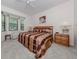 Spacious main bedroom with a king-size bed and ample natural light at 4522 Cancello Grande Ave, Venice, FL 34293
