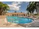Large community pool with surrounding palm trees at 4522 Cancello Grande Ave, Venice, FL 34293