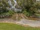 Multi-tiered waterfall feature with lush landscaping at 4522 Cancello Grande Ave, Venice, FL 34293