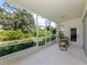 Spacious screened patio with seating area and access to backyard at 4815 Tamarack Trl, Venice, FL 34293