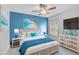 Coastal-themed bedroom with blue walls and wicker furniture at 12232 Stuart Dr, Venice, FL 34293