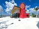 Modern red community building near waterfront with bike rentals at 12232 Stuart Dr, Venice, FL 34293