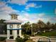 Community entrance with a sign and landscaping at 12232 Stuart Dr, Venice, FL 34293