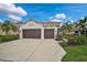 Two-car garage and well-maintained landscaping at 12232 Stuart Dr, Venice, FL 34293