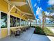 Relaxing outdoor patio with tables and chairs overlooking waterfront at 12232 Stuart Dr, Venice, FL 34293