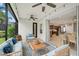 Relaxing screened porch with seating area and view of kitchen at 12232 Stuart Dr, Venice, FL 34293