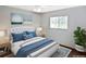 Bright bedroom with a queen bed and window at 4241 Chamrade Rd, North Port, FL 34288