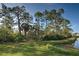Backyard with pond and natural landscape at 1586 Monarch Dr # 1586, Venice, FL 34293
