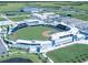 Aerial view of a baseball stadium with surrounding parking at 1586 Monarch Dr # 1586, Venice, FL 34293