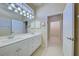 Double vanity bathroom with a shower at 1586 Monarch Dr # 1586, Venice, FL 34293