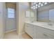 Bathroom with shower and double vanity at 1586 Monarch Dr # 1586, Venice, FL 34293