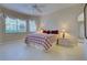 Spacious bedroom with a comfortable bed and ample natural light at 1586 Monarch Dr # 1586, Venice, FL 34293