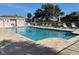 Relaxing community pool with plenty of lounge chairs at 1586 Monarch Dr # 1586, Venice, FL 34293