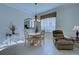 Bright dining area with a table for four and comfortable seating at 1586 Monarch Dr # 1586, Venice, FL 34293