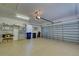 Garage with open door and storage shelving at 1586 Monarch Dr # 1586, Venice, FL 34293