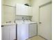 Laundry room with washer, dryer and cabinets at 1586 Monarch Dr # 1586, Venice, FL 34293