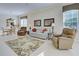 Living room with tile floors and comfy seating at 1586 Monarch Dr # 1586, Venice, FL 34293