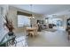Open living and dining area with tile floors and large windows at 1586 Monarch Dr # 1586, Venice, FL 34293