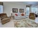 Living area with light beige walls and reclining furniture at 1586 Monarch Dr # 1586, Venice, FL 34293