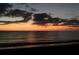 Stunning sunset over the ocean with dramatic clouds at 1586 Monarch Dr # 1586, Venice, FL 34293