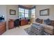 Home office with wood desk and seating at 1586 Monarch Dr # 1586, Venice, FL 34293