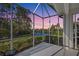 Relaxing screened porch overlooking a serene lake and lush landscape at 1586 Monarch Dr # 1586, Venice, FL 34293