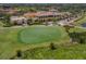 Aerial view of clubhouse and golf course at 277 Mestre Pl, North Venice, FL 34275