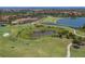 Aerial view of community with golf course and lake at 277 Mestre Pl, North Venice, FL 34275