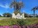Venetian Golf & River Club entrance with lush landscaping and fountain at 277 Mestre Pl, North Venice, FL 34275