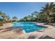 Relaxing resort-style pool with palm trees and lounge chairs at 277 Mestre Pl, North Venice, FL 34275