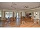 Bright community room with tables, chairs, and a view of the pool at 857 Tartan Dr, Venice, FL 34293