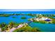 Aerial view of waterfront property with beach access and bridge at 5 N Casey Key Rd, Osprey, FL 34229