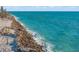 Aerial view of coastline with rocky shoreline and ocean waves at 5 N Casey Key Rd, Osprey, FL 34229