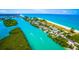 Waterfront community with homes along a canal and beach access at 5 N Casey Key Rd, Osprey, FL 34229