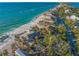 Beachfront property aerial view, showing house and surrounding area at 5 N Casey Key Rd, Osprey, FL 34229