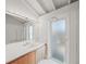 Bathroom with modern vanity and frosted glass door at 5 N Casey Key Rd, Osprey, FL 34229