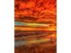 Vibrant sunset colors paint the sky above a tranquil beach scene at 5 N Casey Key Rd, Osprey, FL 34229