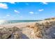 Scenic sandy beach with natural rock formations and ocean views at 5 N Casey Key Rd, Osprey, FL 34229